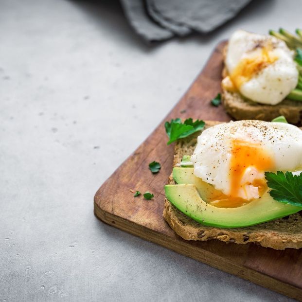 bigstock Poached Eggs And Avocado Sandw 281843659