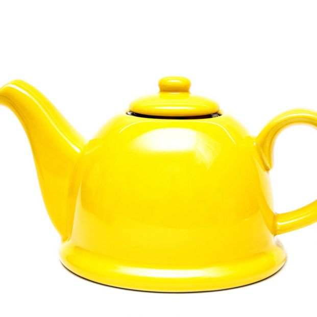 bigstock Ceramic Yellow Teapot On A Whi 366258022
