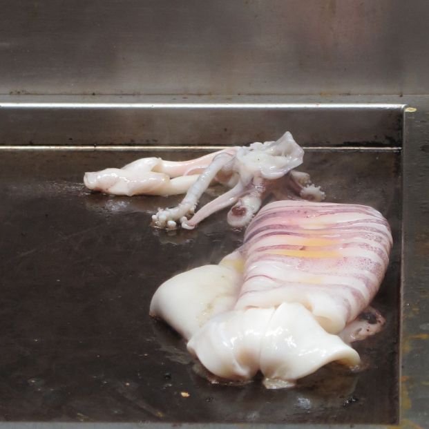 bigstock Large Squid Being Cooked 161956607