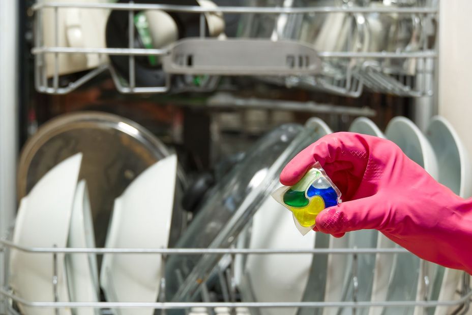 bigstock Dishwasher Detergents In Hands 390659324