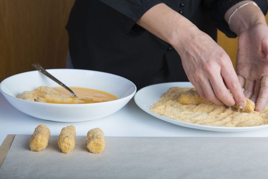 bigstock Chef Preparing Croquettes In T 235093342