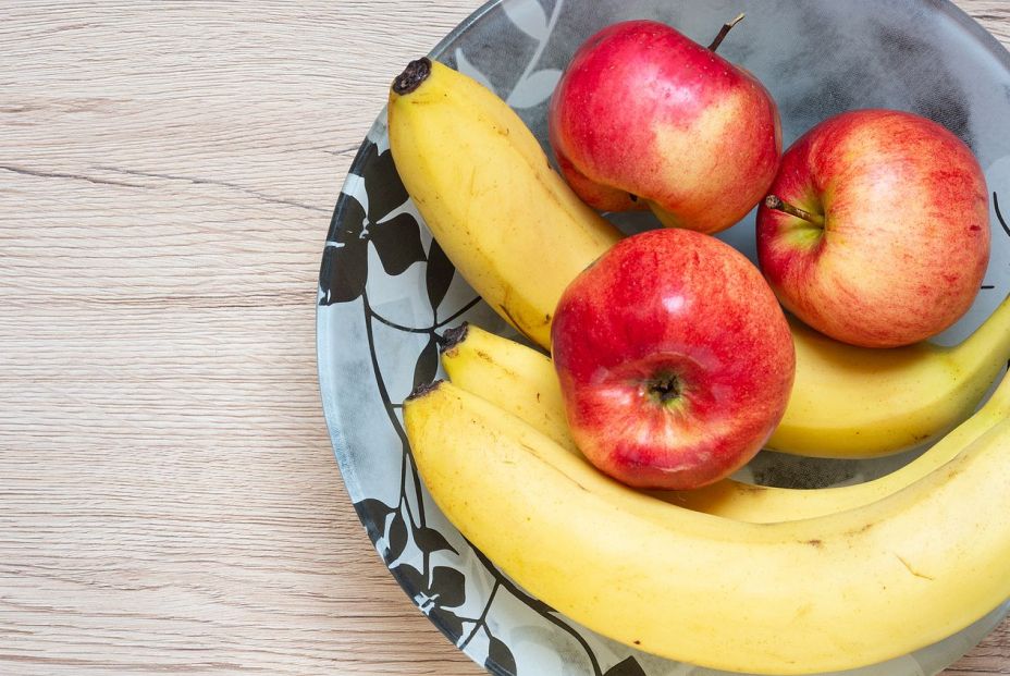 bigstock Bananas And Red Apples On Bow  390148129