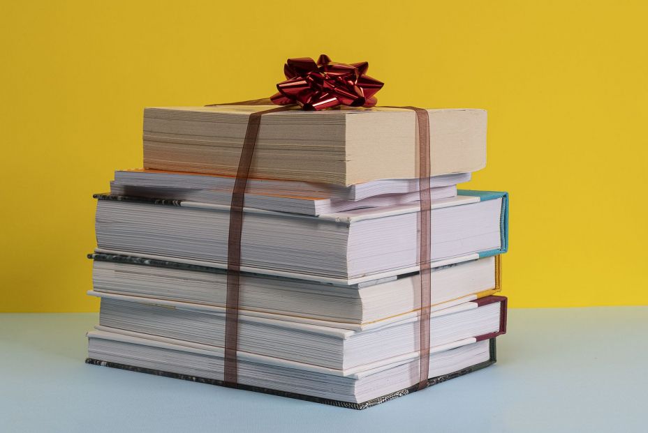 bigstock The Gift Of A Pile Of Books Bo 325598902