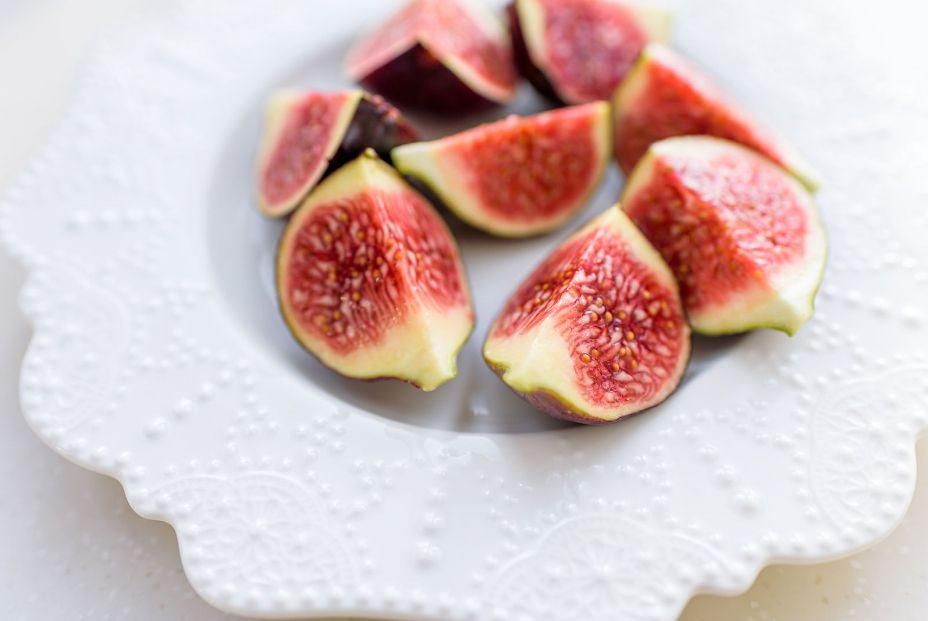 bigstock Chopped Figs On A White Cerami 340305979