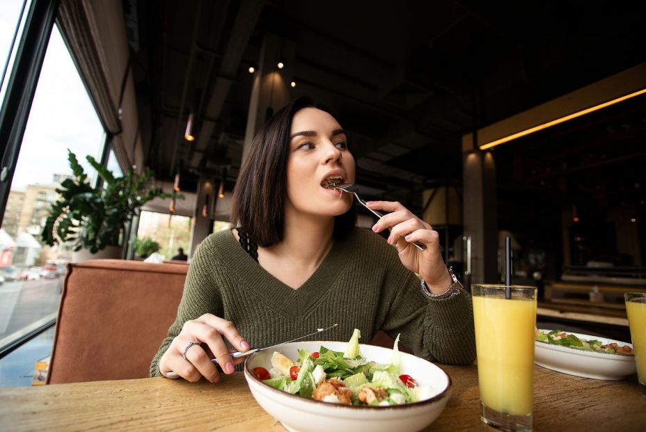 bigstock Young Woman Enjoys Tasty Meal  399873503