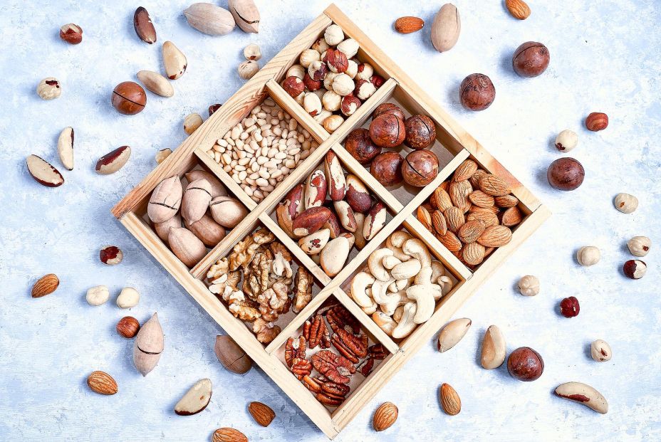 bigstock Assortment Of Nuts In A Wooden 329338174