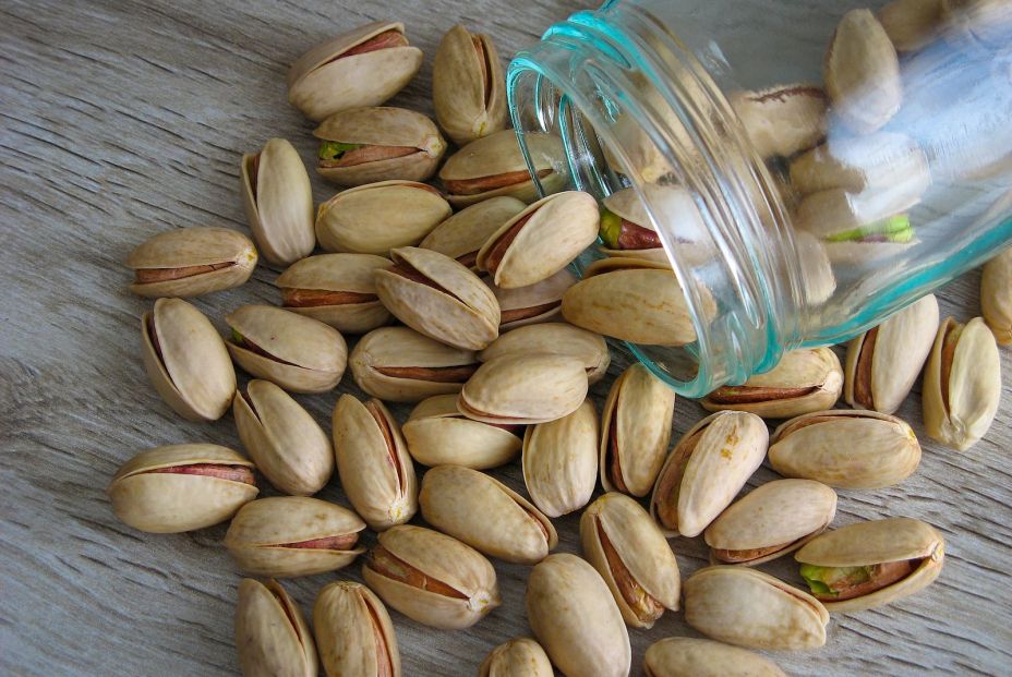 bigstock Pistachios Scattered From A G 371429830