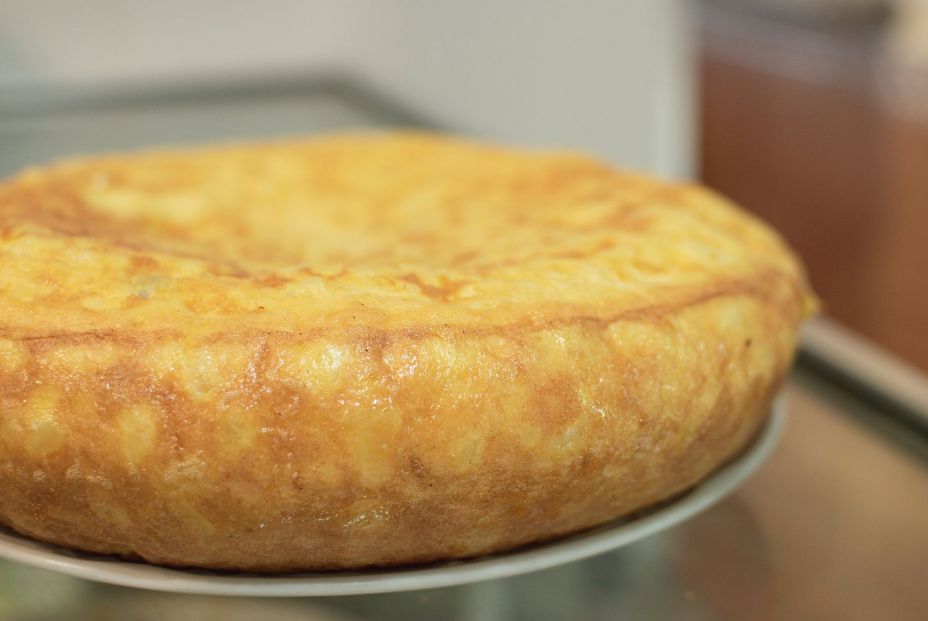 bigstock Spanish Omelette On A White Pl 371774974