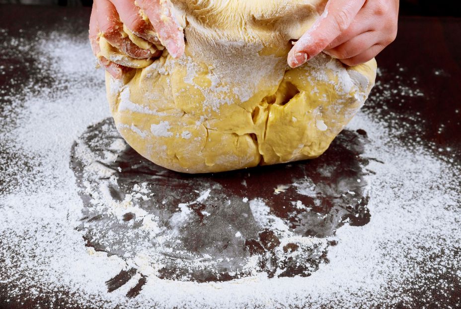 bigstock Woman Kneading Dough For Makin 346173595