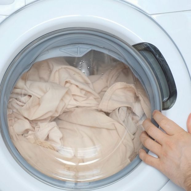 bigstock Mans Hands Loading The Washing 420125494