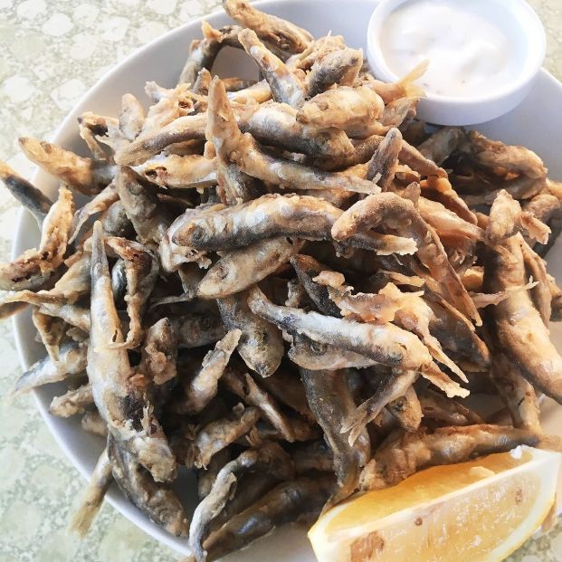 bigstock Fried Anchovies With Lemon And 406634732