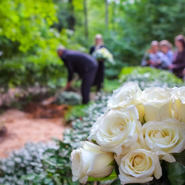 bigstock Roses In Cemetery With People  277235128