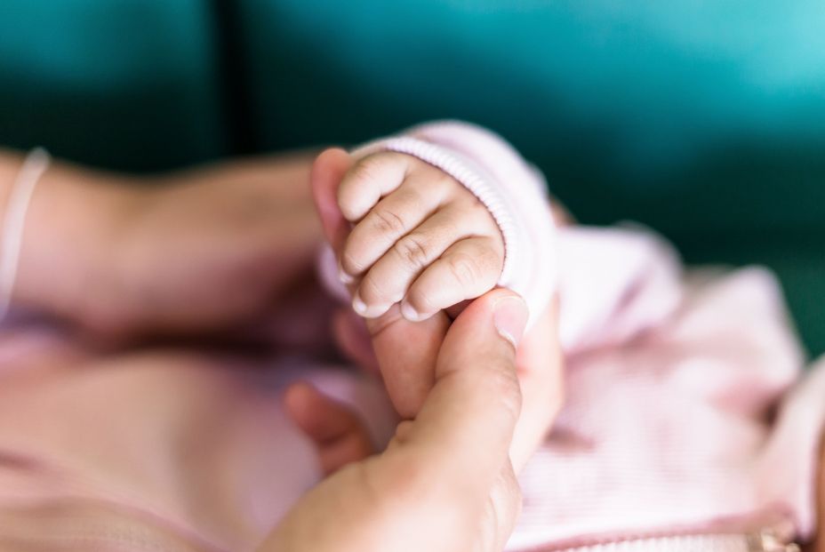 bigstock Soft Focus Of Baby Hands And M 339618700