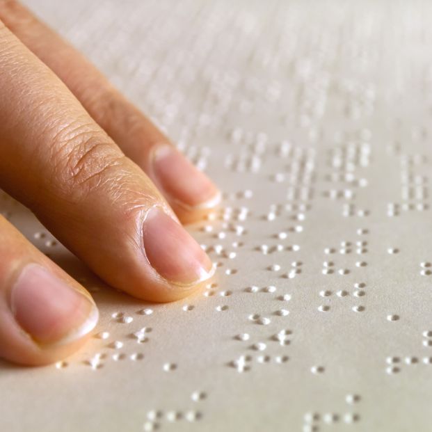 bigstock Braille Reading Blind Woman R 368995723