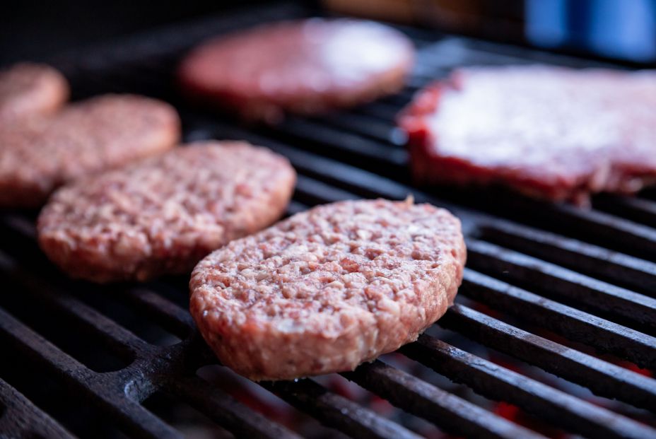 bigstock Raw Beef Burgers With A Pinch  380110816